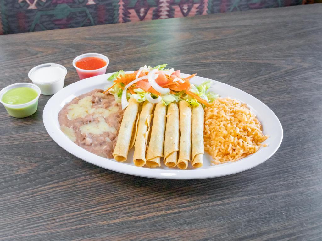 6 Flautas · With rice and beans.