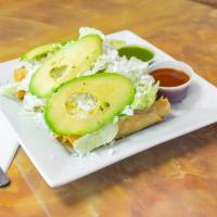 Tacos Dorados · Served with lettuce, Mexican cheese, avocado, sour cream choice (potatoes & chicken).