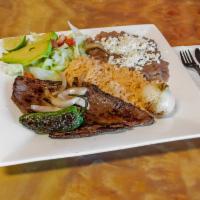 Carne asada plate · Asada,rice,bean. ,salad,green and red sauce on the side Chiles asados side 