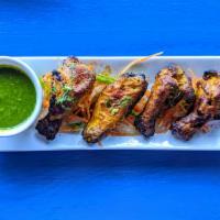Tandoori Wings x 6 · Chicken wings marinated in spiced yogurt and grilled in tandoor. 