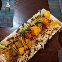 Tandoori Mixed Veg (Available vegan as well) · Mixed vegetables marinated and spices and cooked in a clay oven. 