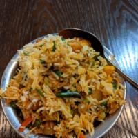 Vegetable Biryani · Basmati rice with assorted vegetables cooked with mild spices. Served with raita. 