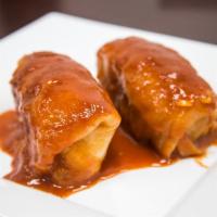 Stuffed Cabbage · 2 pieces of cabbage stuffed with rice and meat.