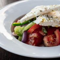 Horiatiki Salad · classic Greek salad, vine ripened tomatoes, cucumbers, red onions, olives, peppers, Arachova...