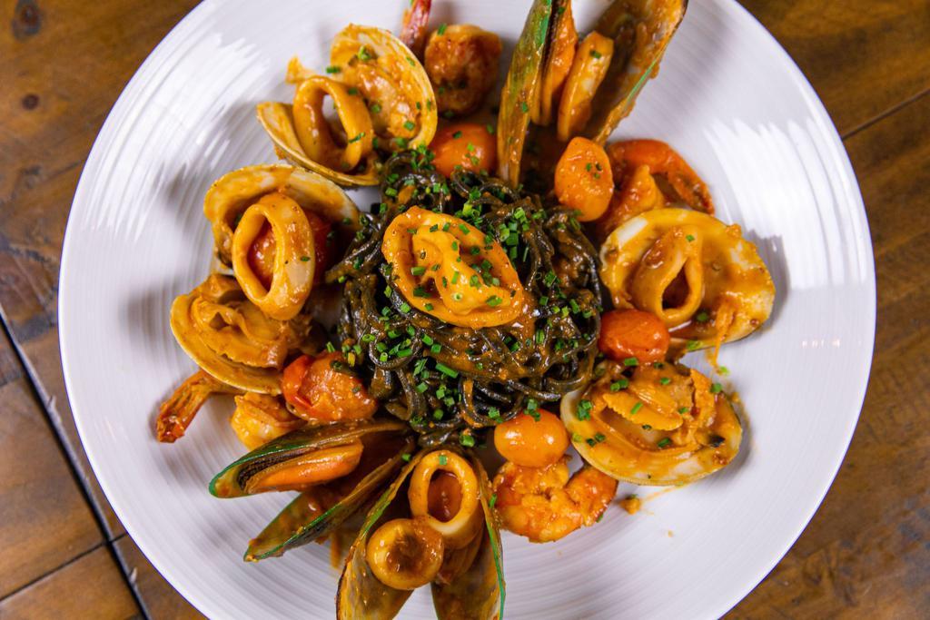 Squid Ink Linguini · shrimp, mussels, Little Neck clams, calamari, cherry tomatoes, fresh herb, wine white tomato sauce 