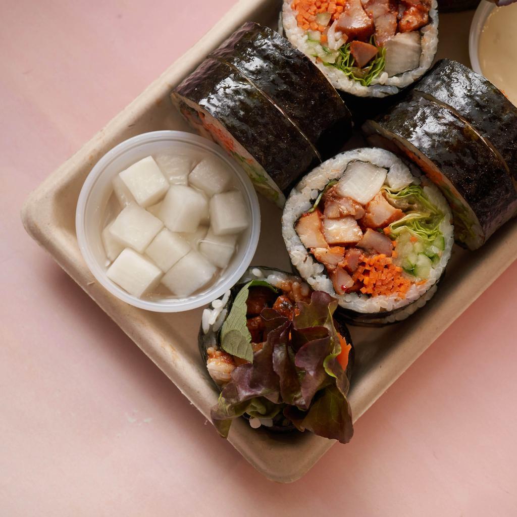 Spicy Gochujang Chicken Kimbap · Gluten-free kimbap roll with all-natural chicken that has been marinated in a spicy gochujang sauce and grilled.  Includes carrots, cucumbers, pickled radish, red leaf lettuce, perilla leaf, sesame seeds, and sesame oil seasoned rice, all rolled together in a seaweed sheet.  