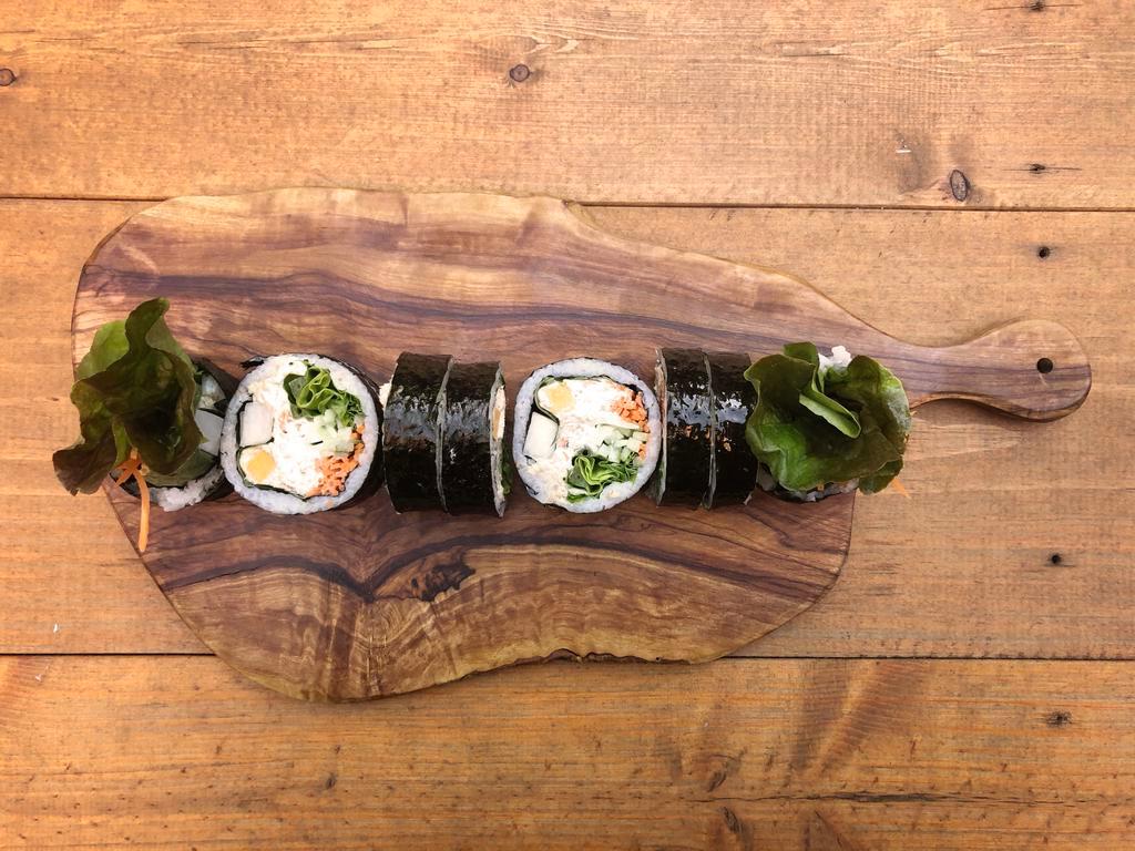 Tuna Kimbap · Gluten-free kimbap roll with wild-caught albacore tuna salad in mayo. Includes carrots, cucumbers, pickled radish, red leaf lettuce, perilla leaf, cheddar cheese, sesame seeds, and sesame oil seasoned rice, all rolled together in a seaweed sheet.