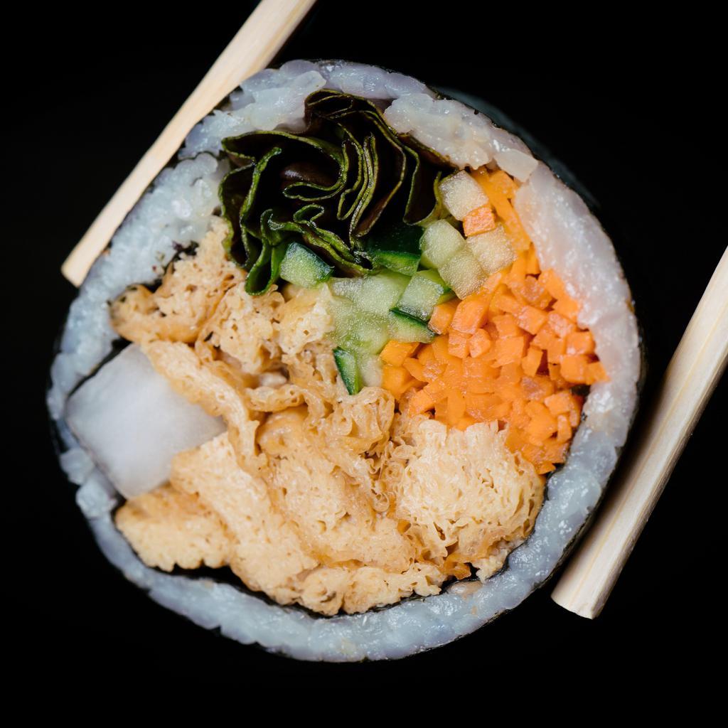 Yubu Kimbap (vegan) · Gluten-free kimbap roll with soy-marinated non-GMO yubu (tofu skins).  Includes carrots, cucumbers, pickled radish, red leaf lettuce, sesame seeds, and sesame oil seasoned rice, all rolled together in a seaweed sheet.  