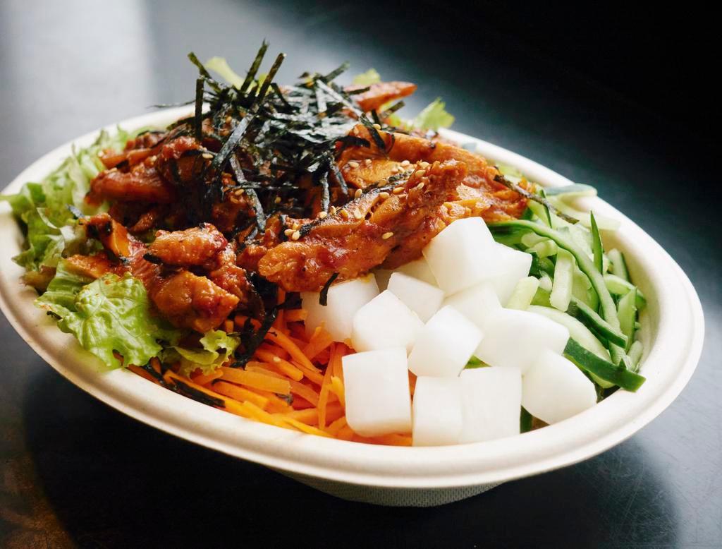 Spicy Gochujang Chicken Bowl · Gochujang chicken, carrots, pickled radish, perilla leaf, red leaf lettuce, cucumbers, sesame oil, sesame seeds.
