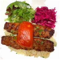 38. Lamb Adana Kebab · Hand chopped lamb served with rice and salad.
