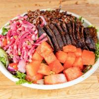 Carne Asada Bowl · Grass-fed sirloin steak with HB achiote marinade, pinto and black beans mixed with himalayan...