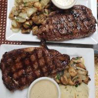 Rib Eye Steak · House cut 10 oz. steak, char grilled to perfection and served with a creamy peppercorn sauce...