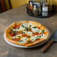 Margherita Pizza m · Tomato pie sauce with fresh mozzarella, basil, olive oil and Parmesan cheese.