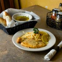 Chicken Francaise · Tender boneless breast dipped in egg batter and sauteed. Served in a white wine and lemon bu...