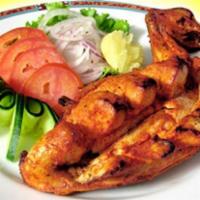 Dera Platter · 3 pieces chicken tikka, 3 pieces lamb tikka and 3 pieces seekh kabab bread and salad.