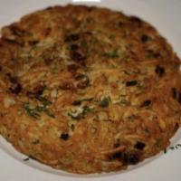 DUCK FAT POTATO CAKE · crunchy with onions 
