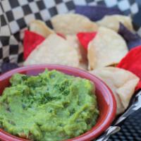 Chips & Guac · Hand-mashed chunky and zesty guacamole. Warm house tortilla chips.