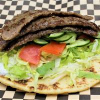 Gyro Wrap · Seasoned beef slices, shredded lettuce, tomatoes, cucumbers, onions, tzatziki sauce. Wrapped...