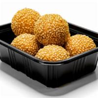 Sesame Balls (6) · Dessert dumplings made from rice flour and filled with smooth red bean paste.