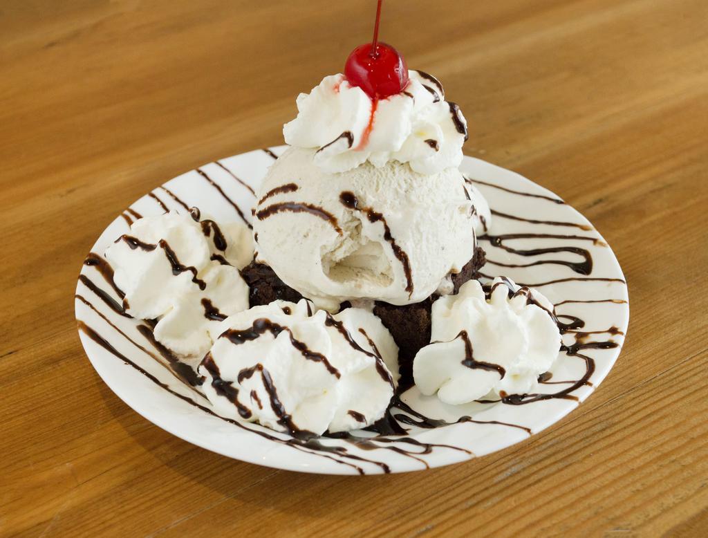 Hot Brownie Fudge Sundae · Chocolate brownie and ice cream, with hot fudge, whipped cream, and cherries.