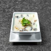 Tom Kha Chicken · Coconut soup with lemongrass, galangal, kaffir lime leaves, cabbage, and mushroom.