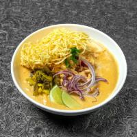 Khao Soi Special · Traditional Northern Thai curry noodle soup, served with shallot, pickle mustard, fried onio...