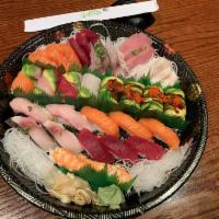 Love Boat · 12 pieces sushi and 15 pieces sashimi, 1 rainbow roll and 1 dragon roll.