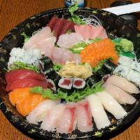 Sushi and Sashimi Combo for 2 · 12 pieces sushi, 18 pieces sashimi, 1 tuna roll and 1 California roll.