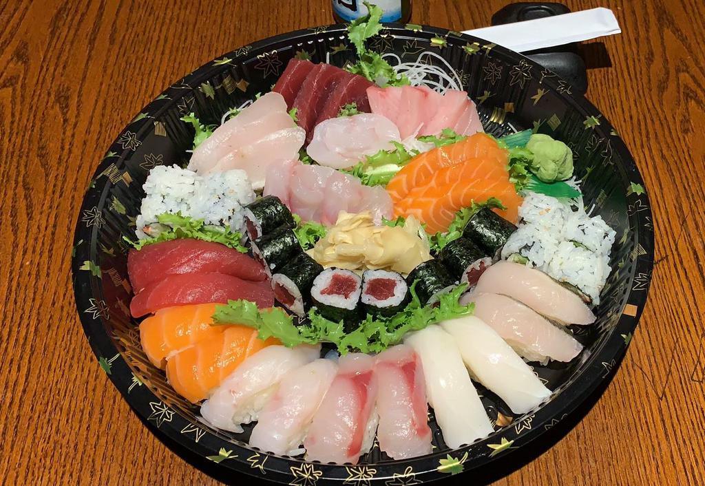 Sushi and Sashimi Combo for 2 · 12 pieces sushi, 18 pieces sashimi, 1 tuna roll and 1 California roll.