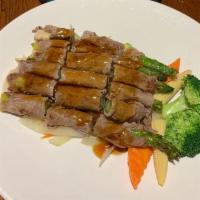 Beef Asparagus Maki · Broiled rolled beef with asparagus in teriyaki in teriyaki sauce.