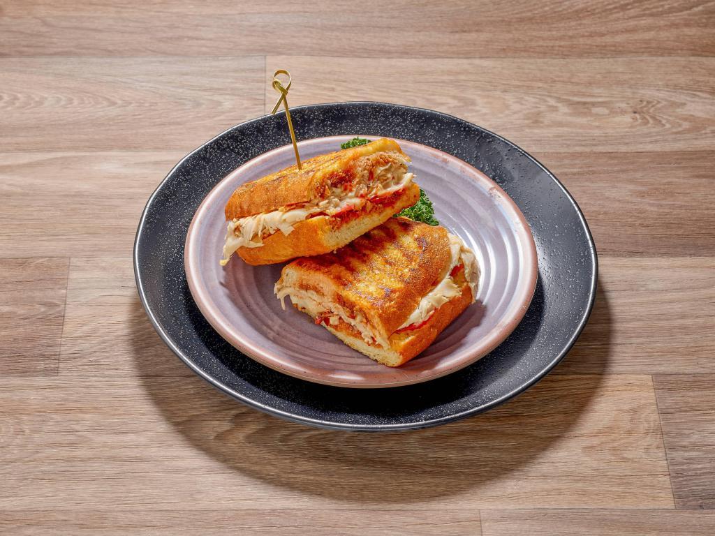 Turkey Panini · Roasted turkey breast, melted Brie, tomato and house made pepper jam.