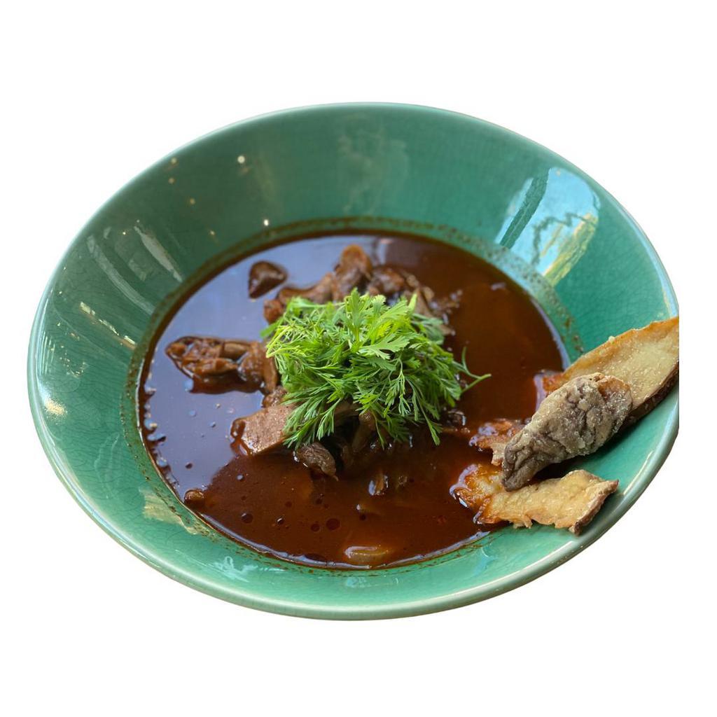 The Mushroom Birria Plato · A veg experience with a timbal of market mushrooms, cooked in their jus, and served with our version of the iconic traditional birria broth from Jalisco. Side of handmade soft tortillas