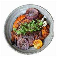Zarandeado · A Charred whole catch of the day, butterfly split, rubbed with achiote adobo, grilled onion,...