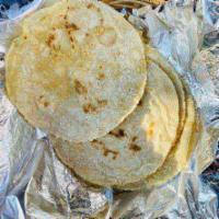Hand Made Tortillas · Made from scratch with heirloom corn masa.