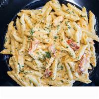 Lobster Pasta · Maine lobster claw chunks tossed in a creamy Alfredo style pasta.