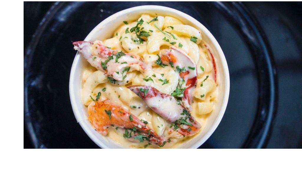 Lobster Mac and Cheese · Creamy macaroni and cheese covered in Maine lobster.