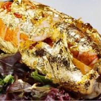 The Golden Lobster Roll · Cold water north Atlantic gulf of Maine lobster claws wrapped in a 24k gold edible leaves an...