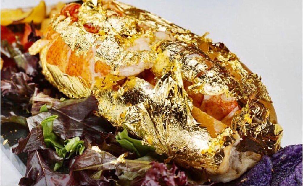 The Golden Lobster Roll · Cold water north Atlantic gulf of Maine lobster claws wrapped in a 24k gold edible leaves and drizzled in a succulent butter sauce. 
