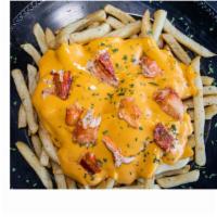 Lobster Loaded Fries · Seasoned fries drizzled in a cheesy, covered with chunks of Maine lobster.