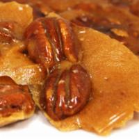 Pecan Brittle · A classic crunchy pecan treat.  Sweet, salty and nutty! 14 ounce.