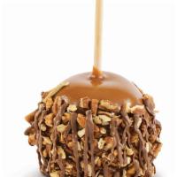 Pecan Turtle Caramel Apple · A tart Granny Smith Apple dipped in Kilwins copper kettle cooked caramel covered in pecans a...