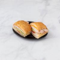 Rotisserie Turkey Sandwich · With lettuce, sliced tomato and maybe some mayo or mustard.