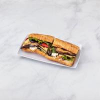 The Grill Veggie Sandwich · Grilled vegetables with basil pesto, arugula, caramelized shallot jam and goat cheese on bag...