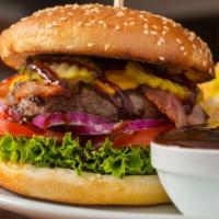 Bacon Cheeseburger · 1/4 lb. juicy beef patty with crispy bacon strips, cheddar cheese, lettuce, tomatoes, and cu...