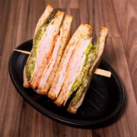 Turkey Supreme · Smoked turkey layered on toasted honey wheat bread with Swiss cheese, lettuce, tomatoes, gua...