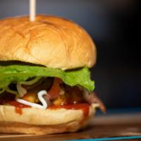 American Grill Burger · Topped with American cheese, bacon, lettuce, tomato, onion and mayonnaise.