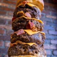 Thanos Burger · 4 Pounds of Angus beef with cheese and bacon inside the burgers and outside the burger. 