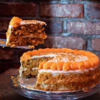 Carrot cake · Double  decker carrot cake with a raisins.  Contains  no nuts.