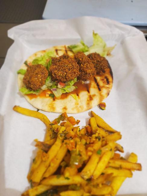 Masala Fries · french fries sauteed in tomatoes, onions, jalapenos, and in house tikka spice