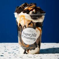 Ice Cream Sundae · Two scoops of ice cream; choice of brownies or broken cones; choice of chocolate, caramel; h...